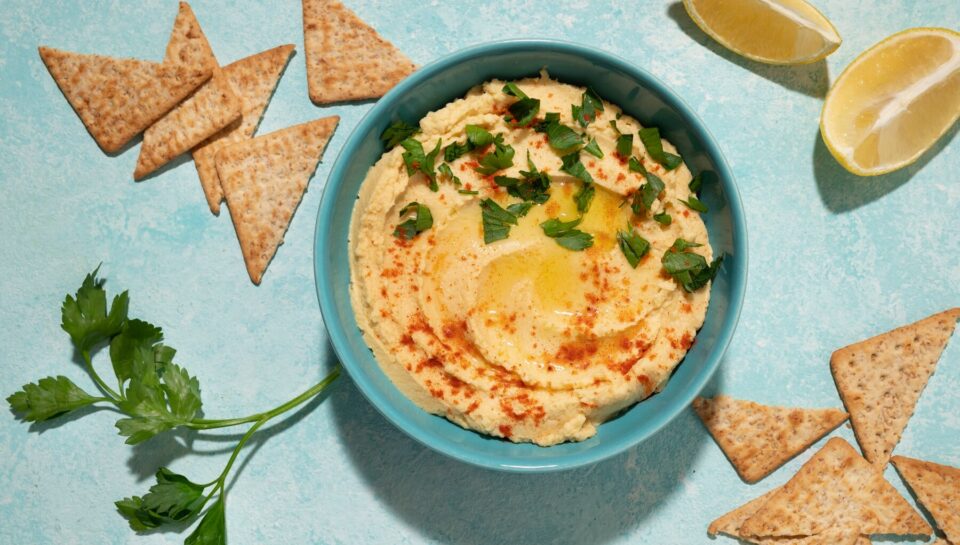 top-view-hummus-crackers-arrangement_23-2149483851